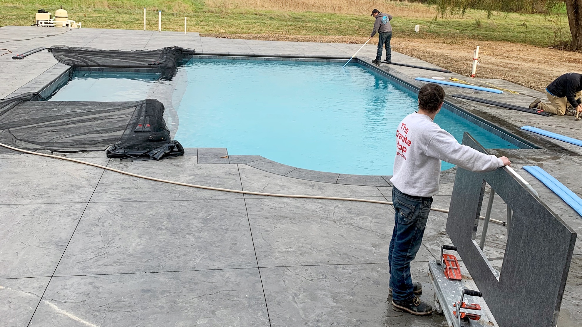 2 techs completing maintenance on above ground pool